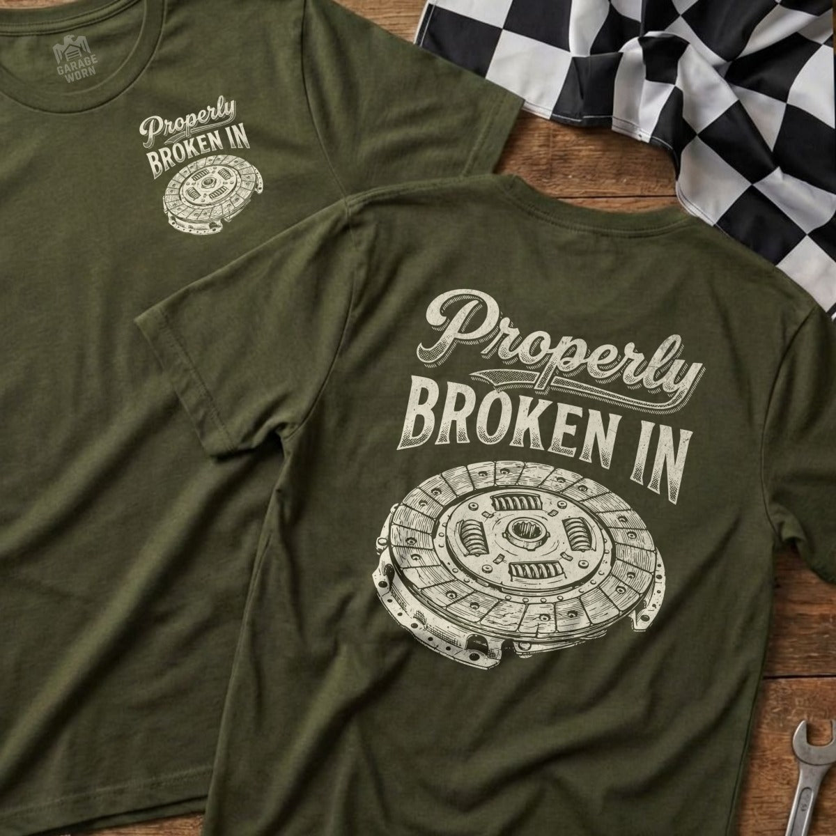 Olive green t-shirt with "Properly Broken In" and clutch disc graphic.