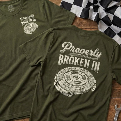 Olive green t-shirt with "Properly Broken In" and clutch disc graphic.