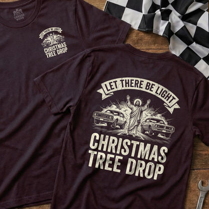 Jesus with cars and "Christmas Tree Drop" text on burgundy t-shirts.