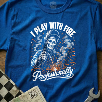 Blue t-shirt with skeleton welder graphic and text "I Play With Fire Professionally".
