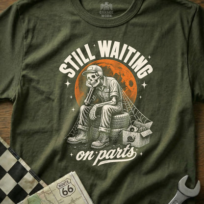 Skeleton mechanic sits on tires, text reads "Still Waiting on Parts".
