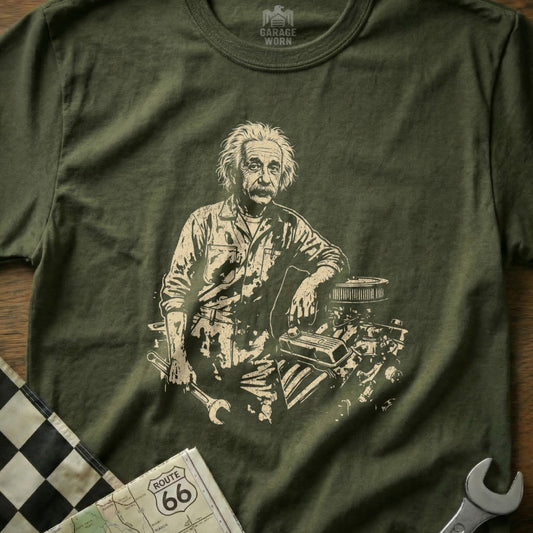 Albert Einstein leaning on an engine, holding a wrench, on a t-shirt.
