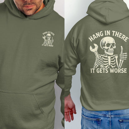 Olive green hoodie with skeleton graphic saying "Hang In There, It Gets Worse".