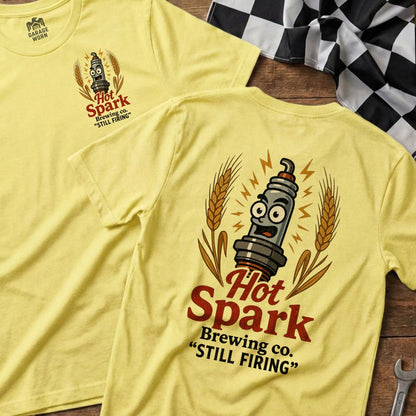 Yellow t-shirt with "Hot Spark Brewing co. 'STILL FIRING'" text and cartoon spark plug.
