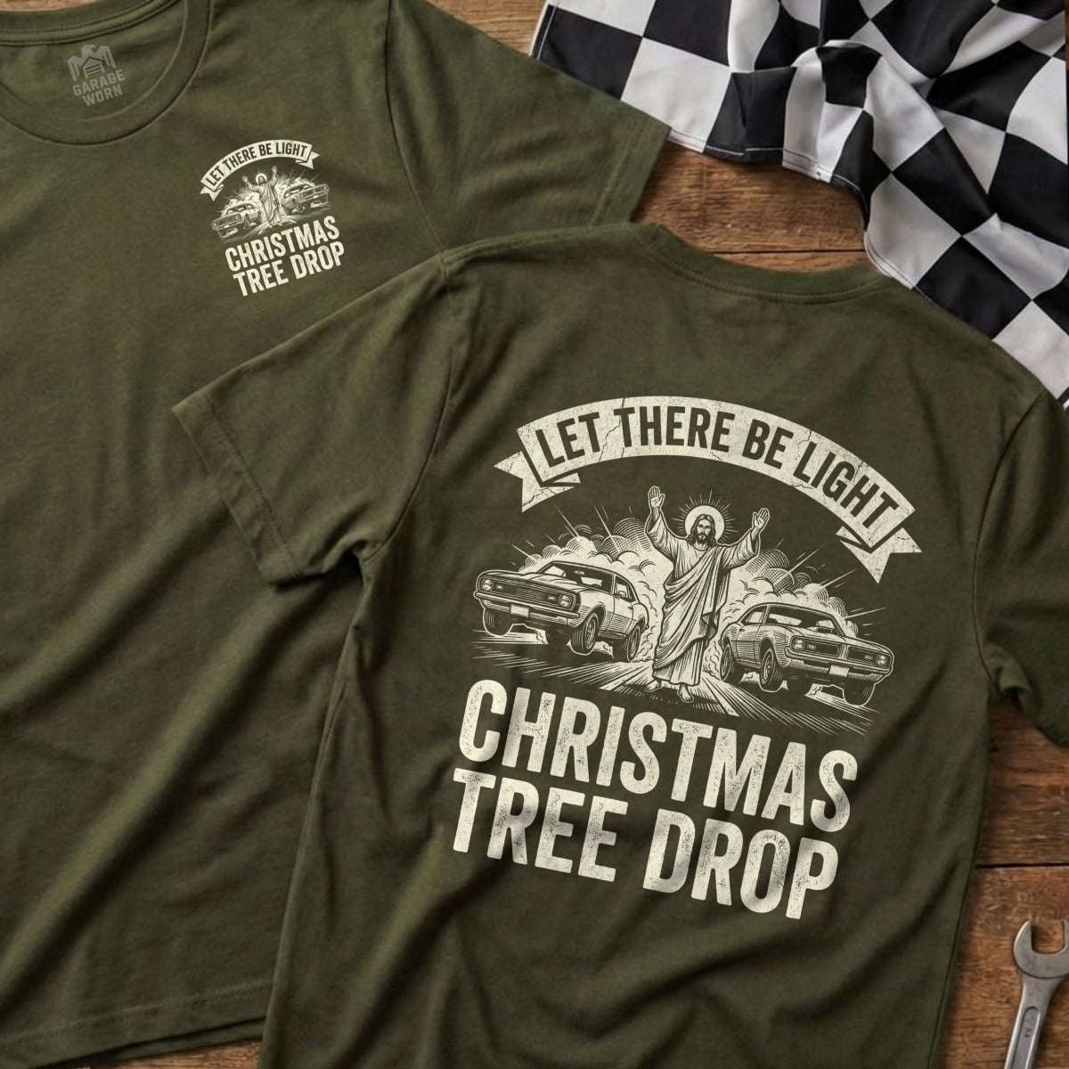 Olive green t-shirt with "Let There Be Light Christmas Tree Drop" and Jesus between two muscle cars.
