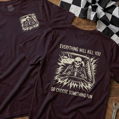 Dark t-shirt with skeleton driving, text reads "Everything will kill you so choose something fun".