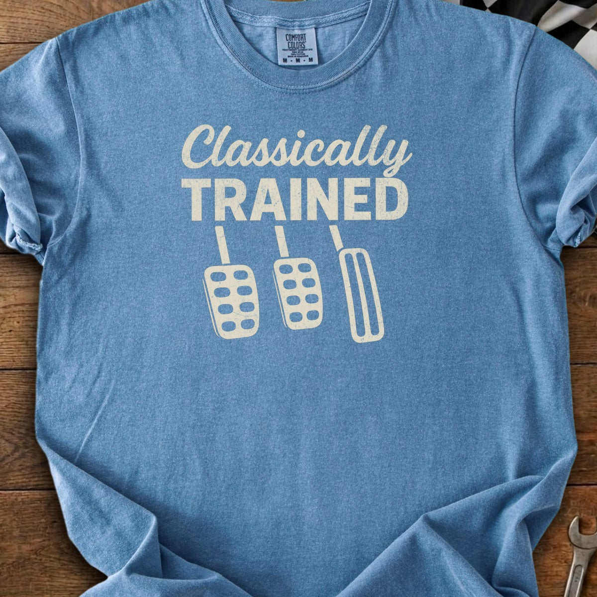 Blue t-shirt with "Classically TRAINED" text and three pedal graphics.