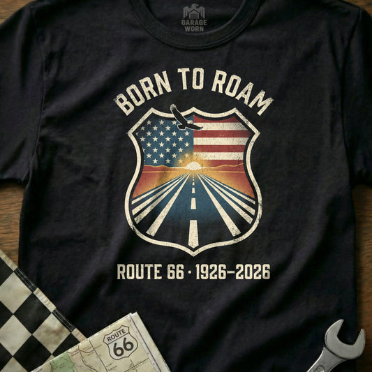 Black t-shirt with "Born to Roam Route 66 1926-2026" text and shield graphic.