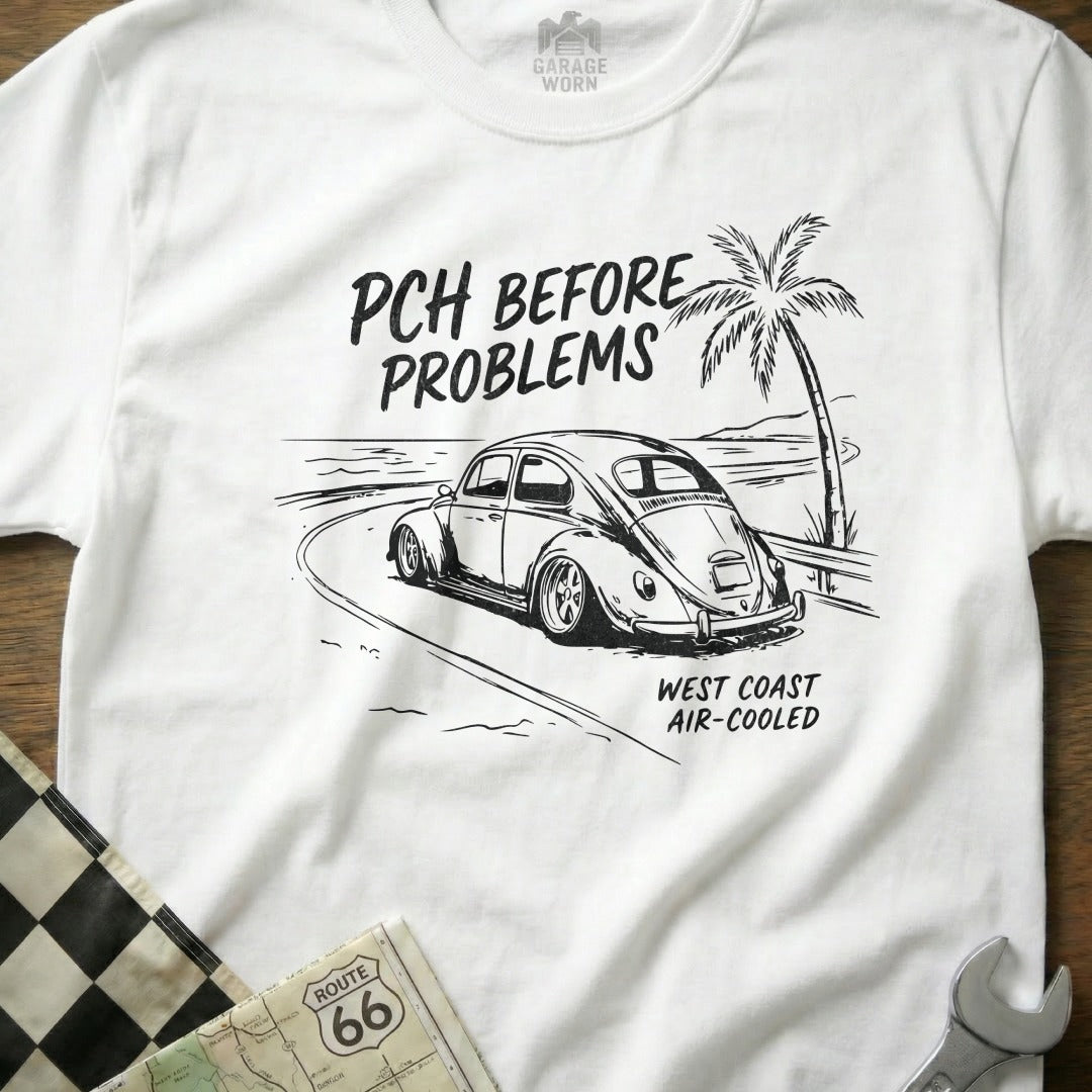 White t-shirt with black sketch of a VW Beetle on PCH, "PCH BEFORE PROBLEMS WEST COAST AIR-COOLED".