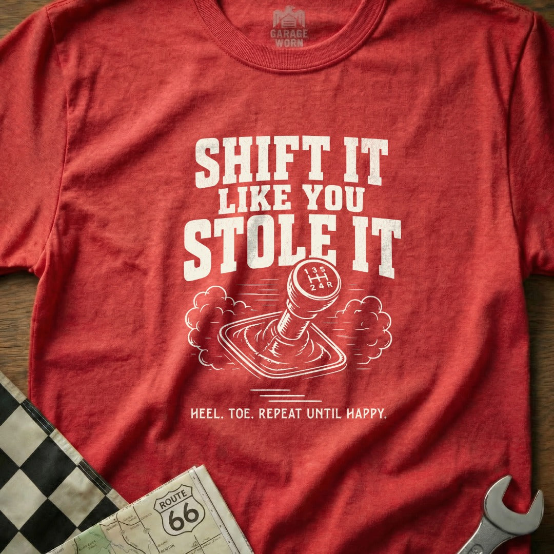 Red t-shirt with "SHIFT IT LIKE YOU STOLE IT" and gear shifter graphic.
