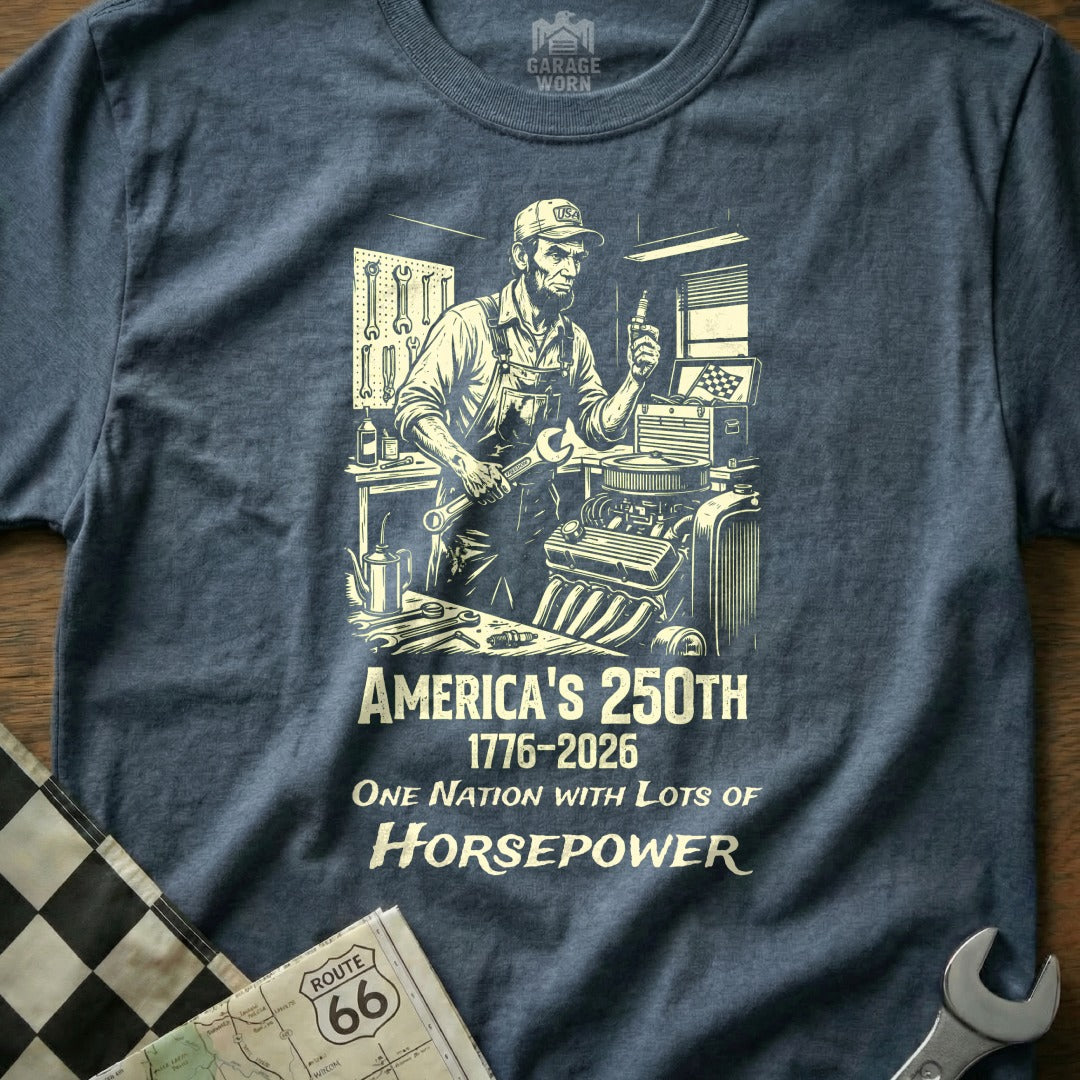 T-shirt design with mechanic, engine, and "America's 250TH" text.