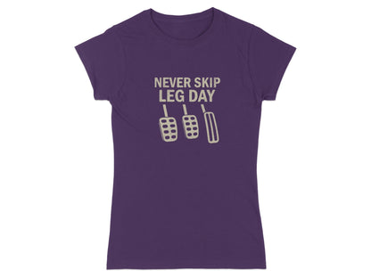 Purple t-shirt with "Never Skip Leg Day" text and pedal graphic.