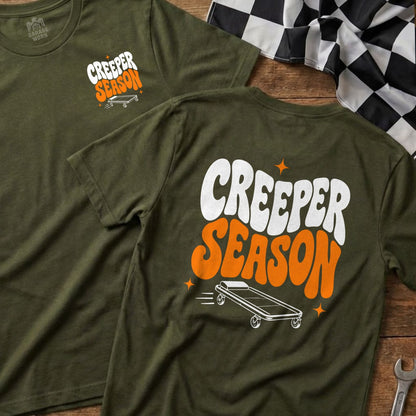 Olive green t-shirt with "CREEPER SEASON" text and a rolling creeper.