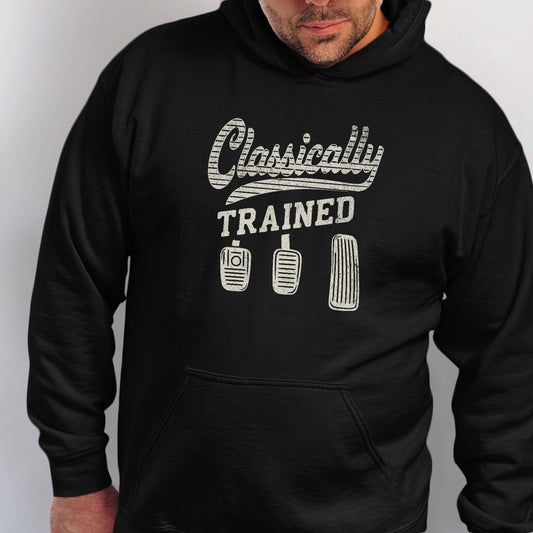 Black hoodie with "Classically TRAINED" text and three car pedals graphic.
