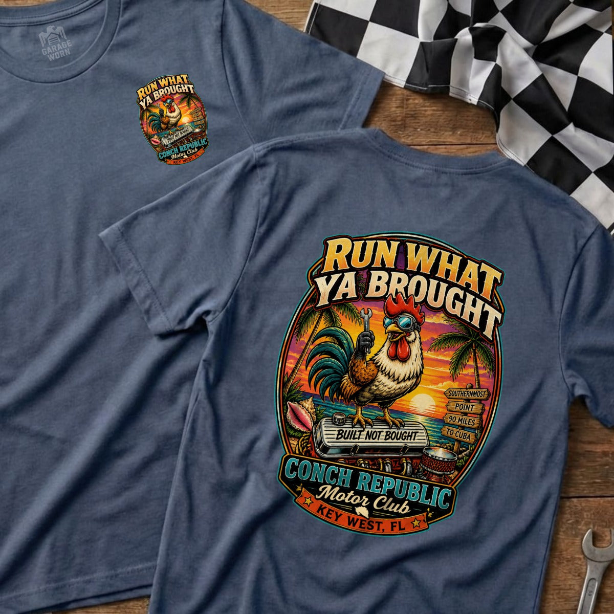 Blue t-shirt with rooster graphic and text "RUN WHAT YA BROUGHT".