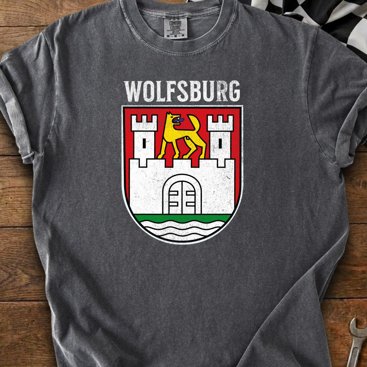 Wolfsburg emblem t-shirt with yellow dog and castle on white shield.