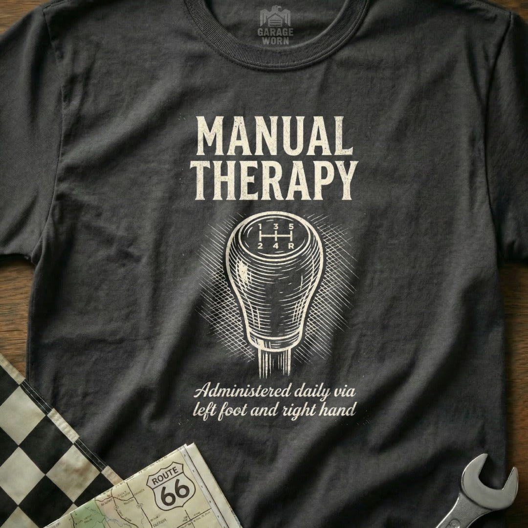 Dark grey t-shirt with "Manual Therapy" and gear shift illustration.