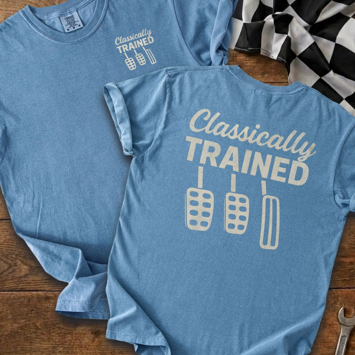 Blue t-shirt with "Classically TRAINED" and three pedal icons.