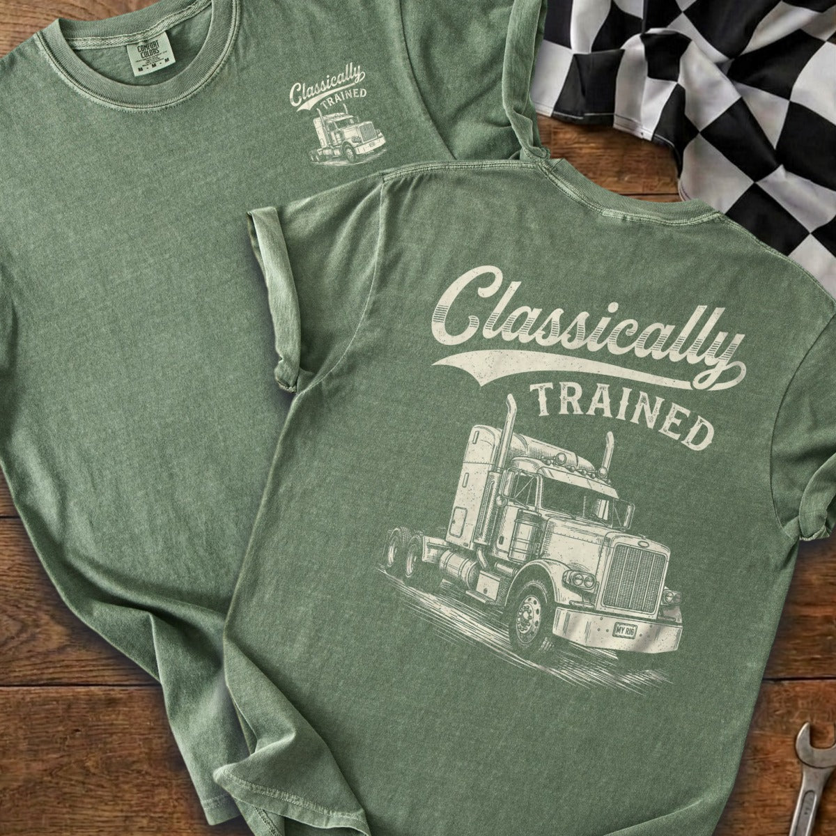 Green t-shirt with white graphic of a truck and "Classically TRAINED" text.