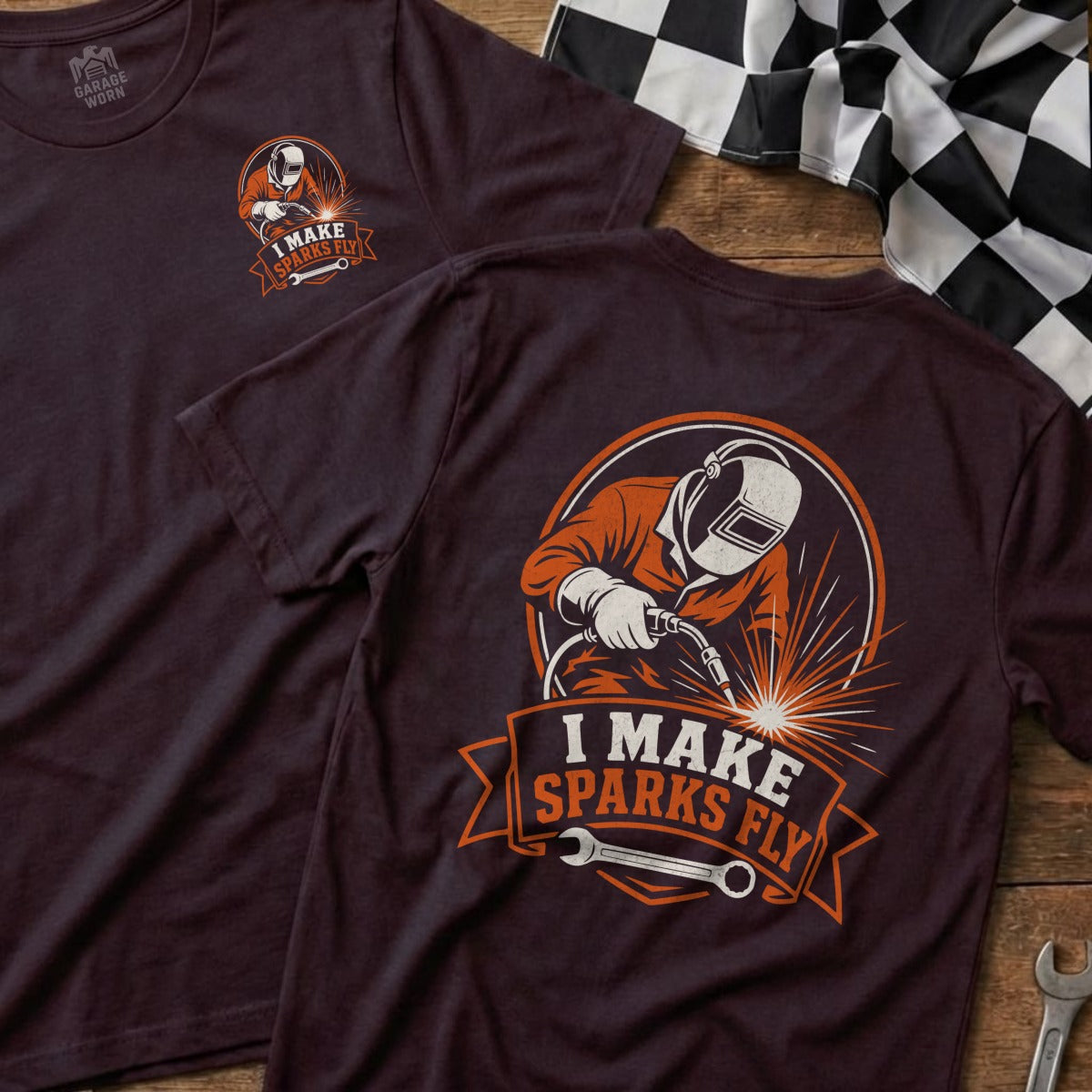 T-shirt graphic of a welder in orange, with the text "I MAKE SPARKS FLY".