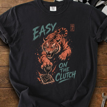 T-shirt with roaring tiger paw on a manual stick shift and text "EASY ON THE CLUTCH".