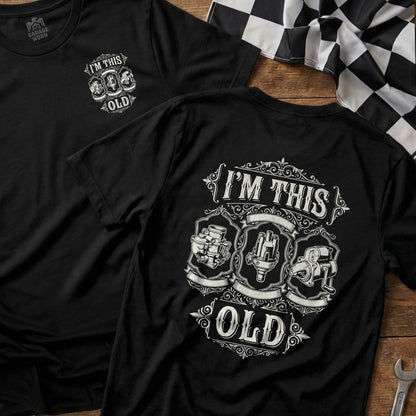 Black t-shirt with "I'm This Old" text and vintage car parts graphic.