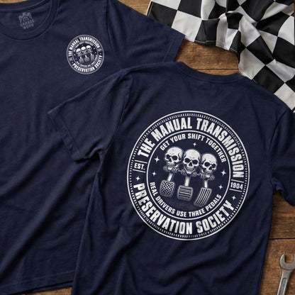 Navy t-shirt with circular graphic featuring skulls on gear shift, pedals, and text.