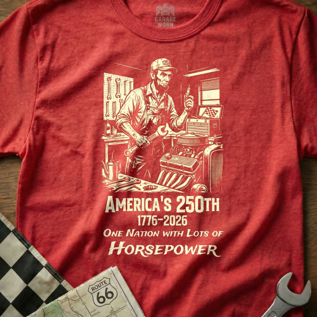 Red t-shirt with mechanic graphic and "America's 250th 1776-2026" text.