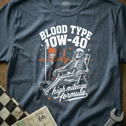 Skeleton receiving IV drip of 10W-40 motor oil, "Blood Type 10W-40 high mileage formula" text.