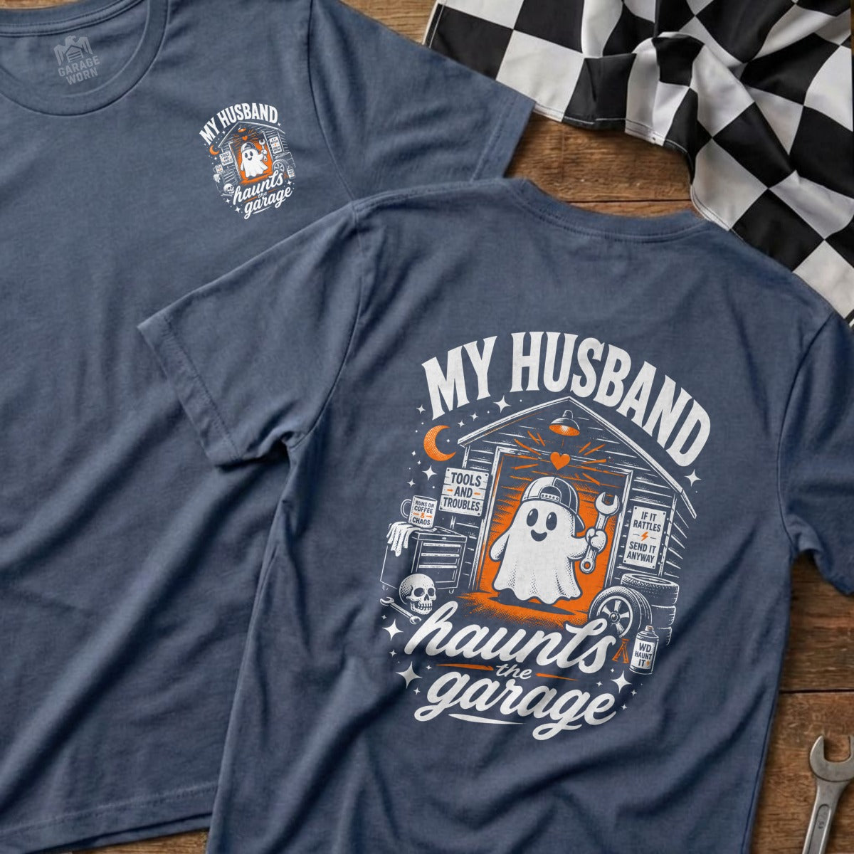Blue t-shirt with "My Husband Haunts the Garage" ghost graphic and garage items.