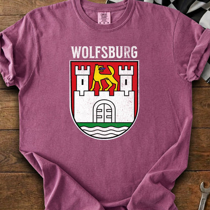 Wolfsburg text above a coat of arms with a yellow dog in front of a castle.