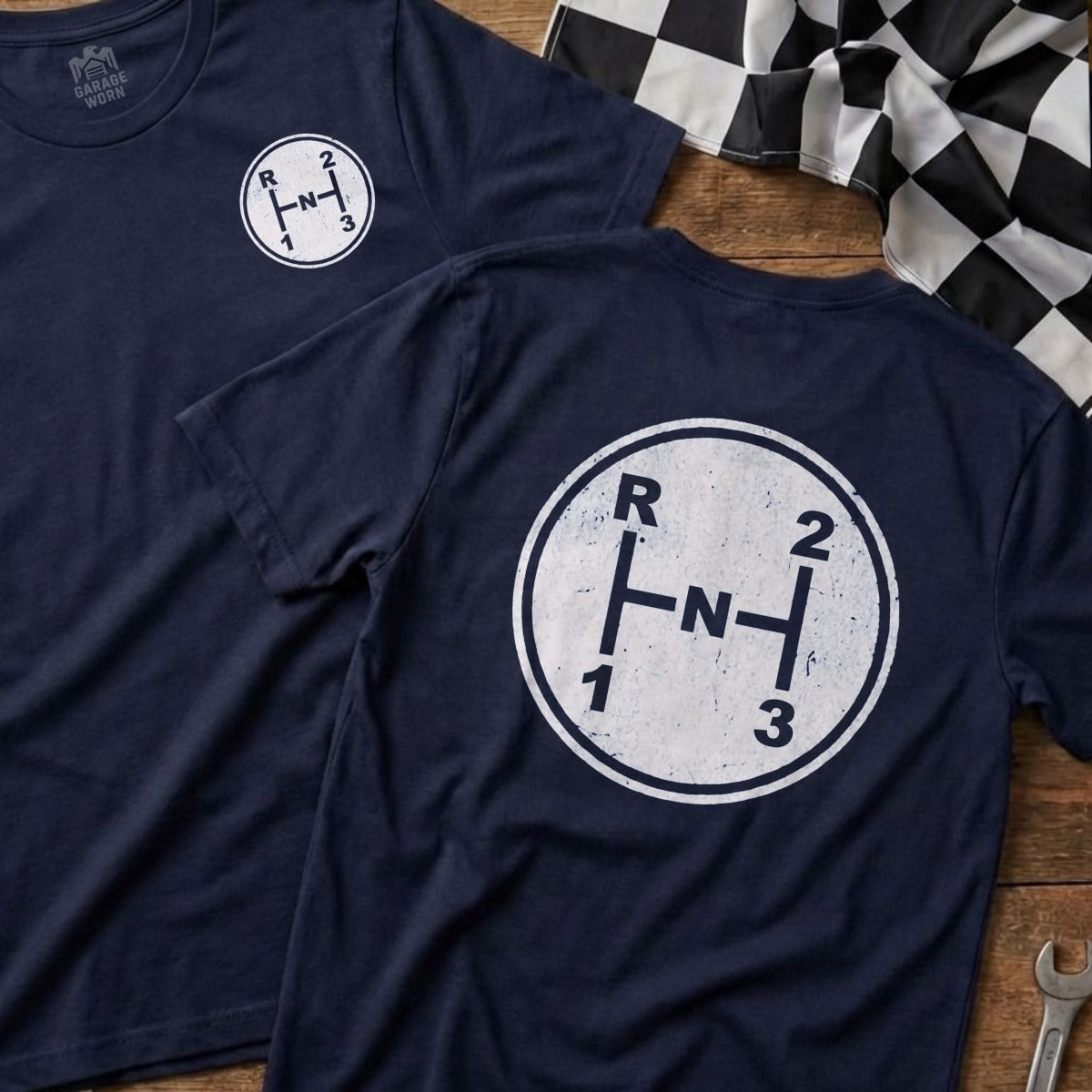 Dark blue t-shirts with a white manual gear shift pattern graphic.