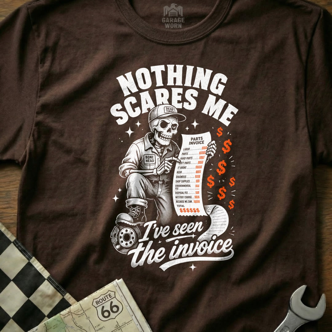 Skeleton mechanic reads long invoice with humor. "Nothing scares me, I've seen the invoice."