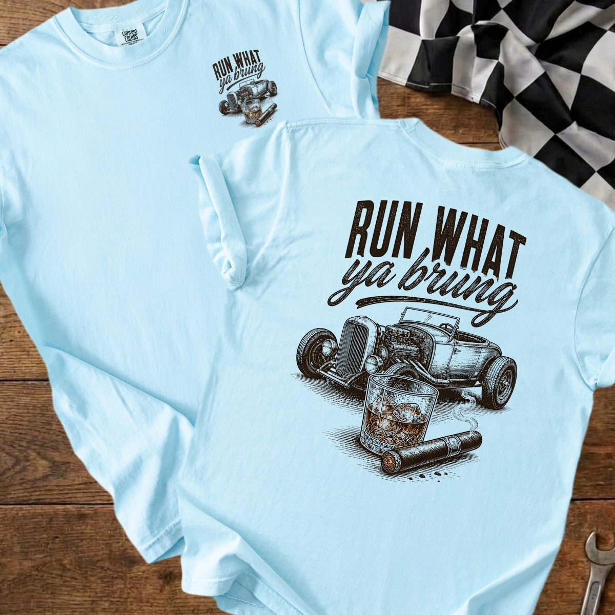 Light blue t-shirt with "RUN WHAT YA BRUNG" text, hot rod, whiskey, and cigar graphic.