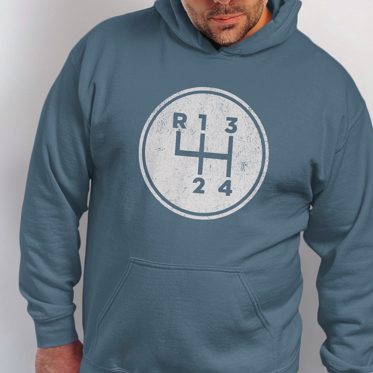 Blue hoodie with a distressed manual car gear shift pattern graphic.