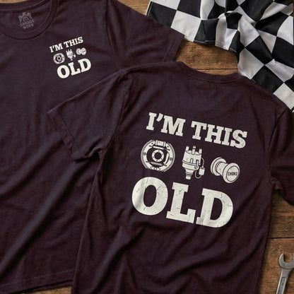 Maroon t-shirt with "I'm This Old" and vintage car parts.