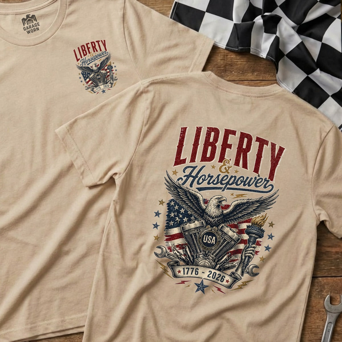 Tan t-shirt with bald eagle, engine, American flag, and "Liberty & Horsepower 1776-2026" graphic.