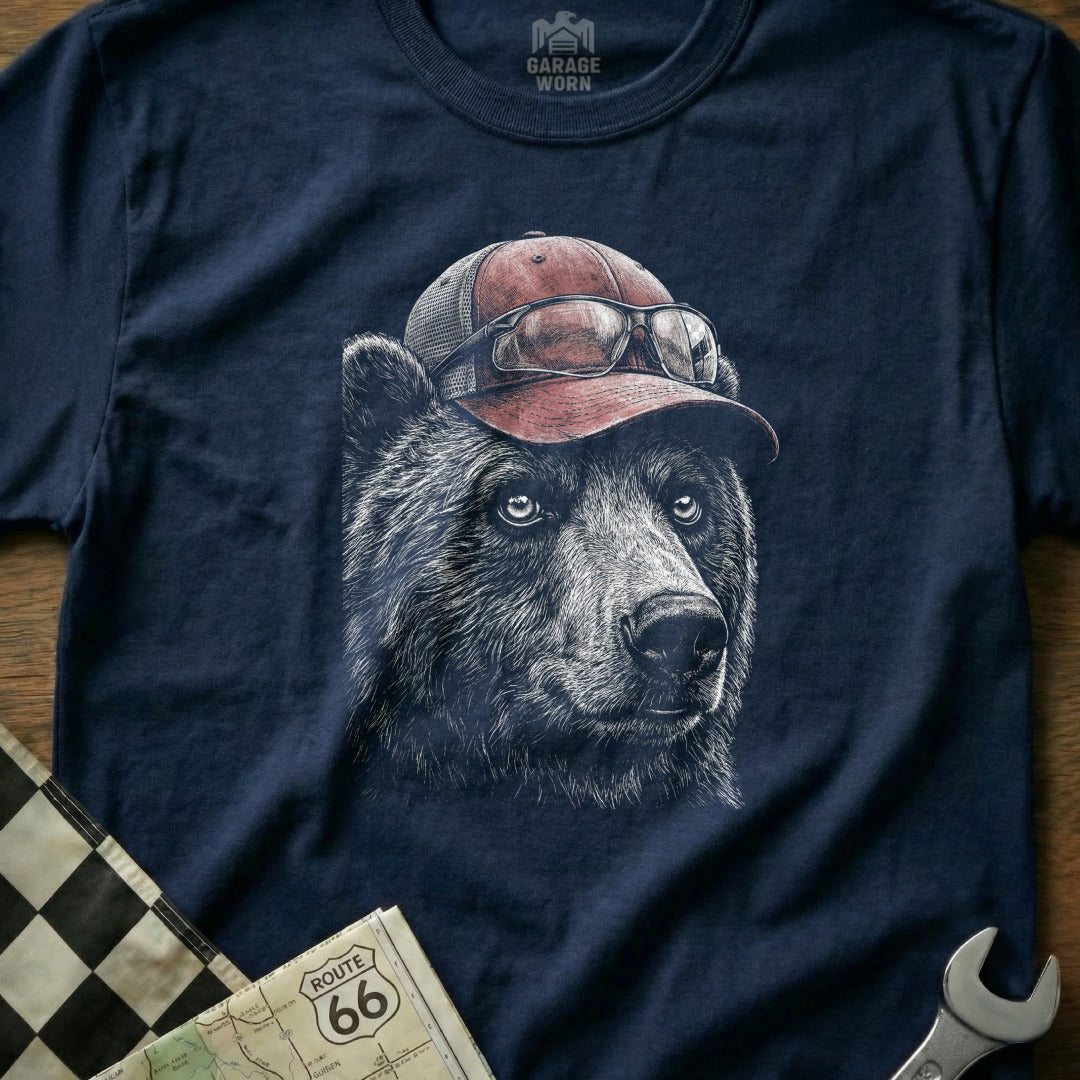 Bear wearing a baseball cap and sunglasses, with a map and wrench.