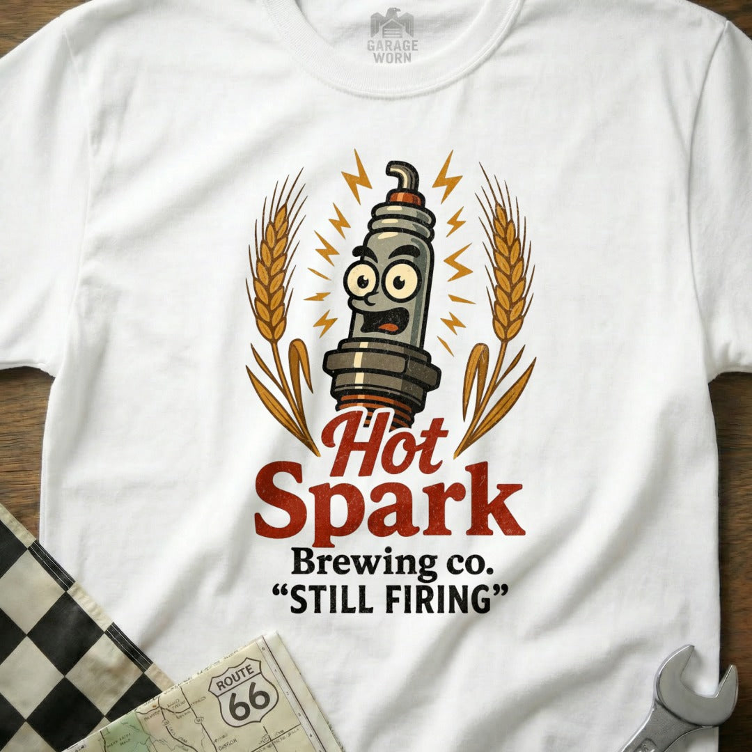 Hot Spark Brewing Co. "Still Firing" graphic on a white t-shirt.