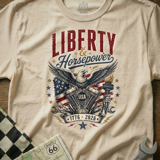 T-shirt graphic: Liberty & Horsepower, USA eagle, US flag, motorcycle engine, torch, 1776-2026.
