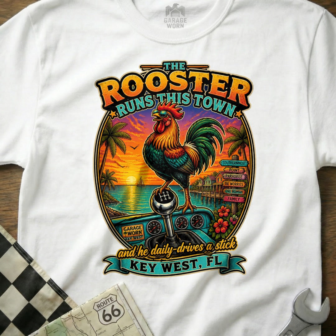 Rooster on a stick shift with Key West sunset and text "The Rooster Runs This Town".
