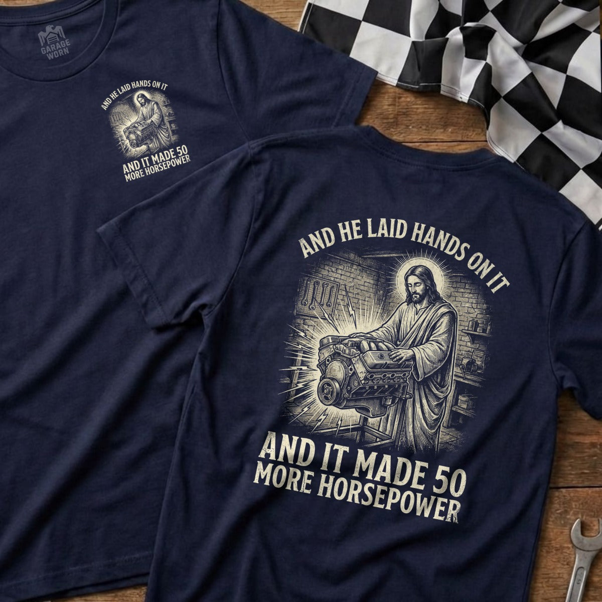Jesus working on an engine with text "And He Laid Hands On It".