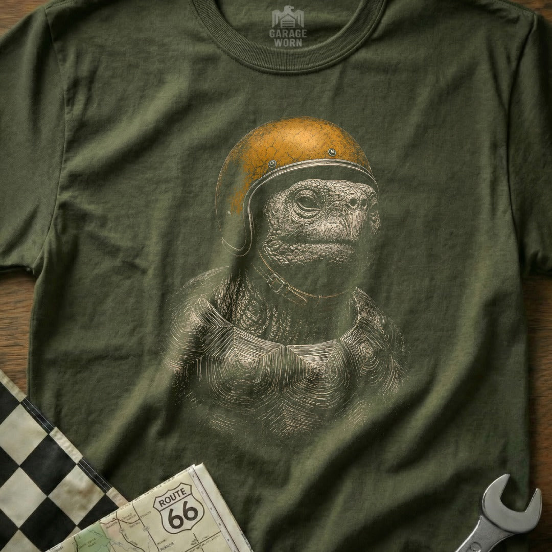 Green t-shirt with a detailed graphic of a tortoise wearing a vintage yellow helmet.