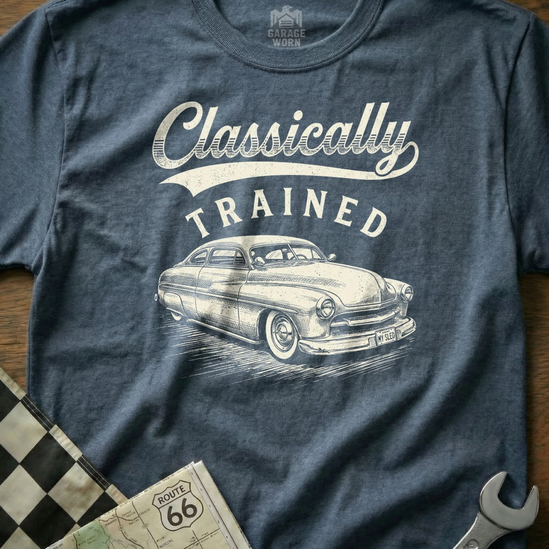 "Classically Trained" text and a vintage car illustration on a blue t-shirt.