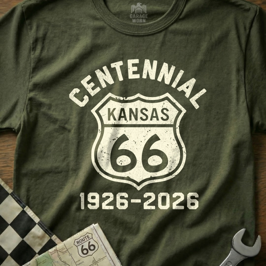 Olive t-shirt with "CENTENNIAL KANSAS 66 1926-2026" Route 66 shield design.