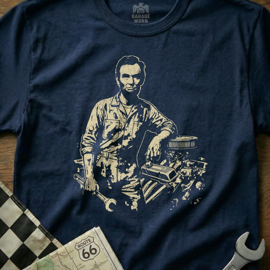 Abraham Lincoln wearing a mechanic's uniform leaning on an engine.