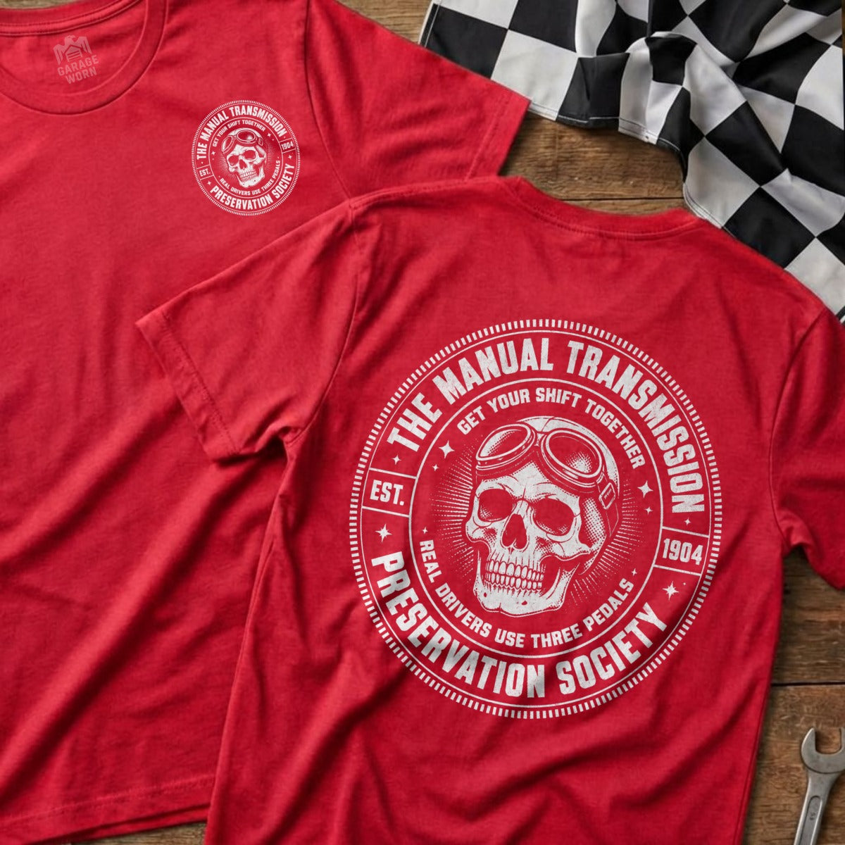 Red t-shirt with "The Manual Transmission Preservation Society" logo featuring a skull with goggles.