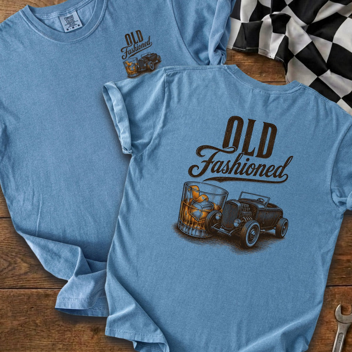 Blue t-shirt with "Old Fashioned" text and a hot rod beside a glass of whiskey.