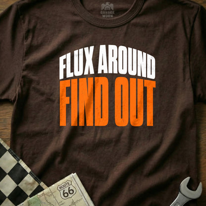 Brown t-shirt with white and orange text "FLUX AROUND FIND OUT".