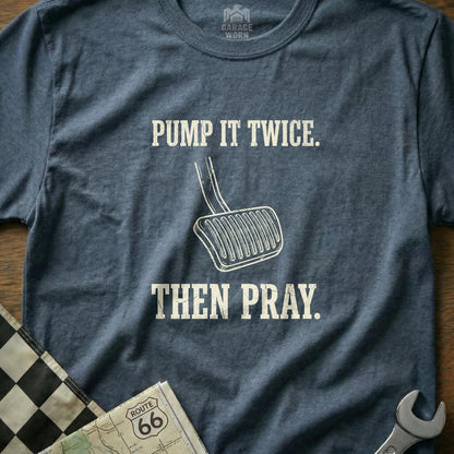 Navy t-shirt with "PUMP IT TWICE. THEN PRAY." text and a gas pedal graphic.